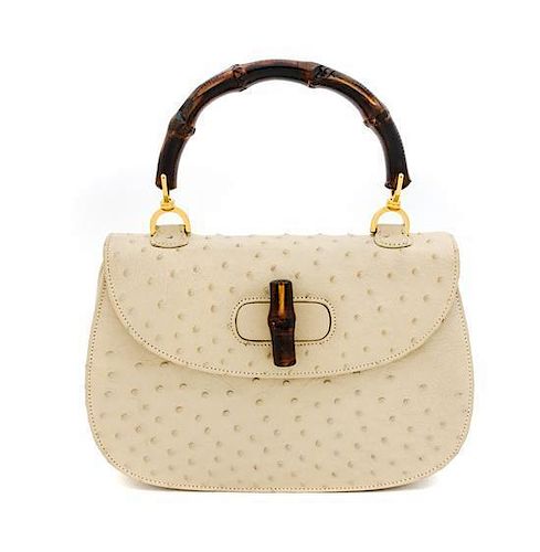 A Gucci Cream Ostrich Bamboo Top Handle Bag, 10.5" x 7.5" x 3".