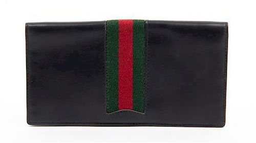 A Gucci Black Checkbook Cover, 6.25 x 3.25. sold at auction from 2nd  December to 8th December