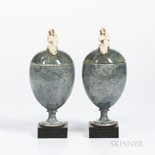 Pair of Wedgwood & Bentley Porphyry Vases and Covers, England, c. 1780, gilded white terra-cotta widow finials atop a goblet shape set atop a square b