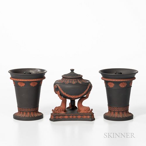 Three Wedgwood Black Basalt Items, England, 19th century, each with applied rosso antico in relief, a dolphin incense burner with cover and insert, ht