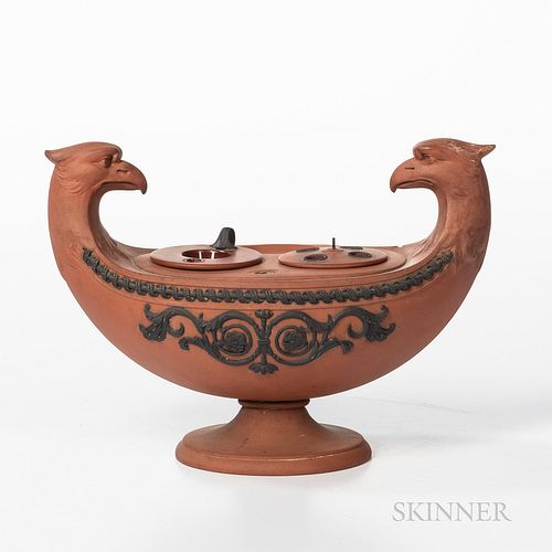 Wedgwood Rosso Antico Inkstand, England, early 19th century, oval form modeled with two bird-head handles and two central wells with inserts, coiled r