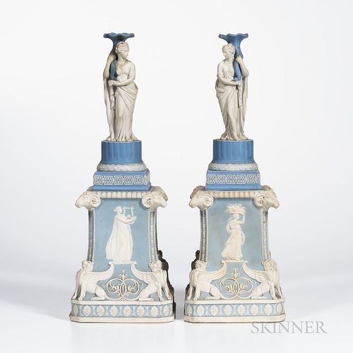 Pair of Wedgwood Jasper Figural Candlesticks on Plinths, England, 19th century, each blue and white, the candlesticks with classical maidens supportin