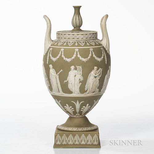 Wedgwood Green Jasper Dip Urn and Cover, England, late 19th century, ovoid shape with applied white classical Muses centering foliate borders and with