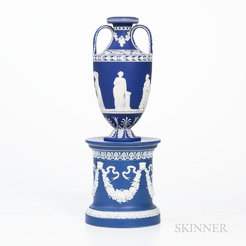 Wedgwood Dark Blue Jasper Dip Vase on a Drum Base, England, 19th century, applied white classical figures in relief to a vase bordered with laurel ban