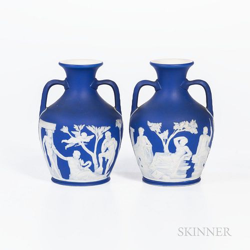 Pair of Wedgwood Dark Blue Jasper Dip Portland Vases, England, 19th century, each with applied white classical figures in relief, impressed marks, ht.