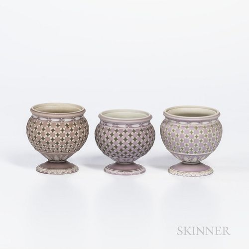 Three Wedgwood Tricolor Diceware Jasper Dip Jars, England, early 19th century, each with applied white relief and lilac ground, two with similar darke