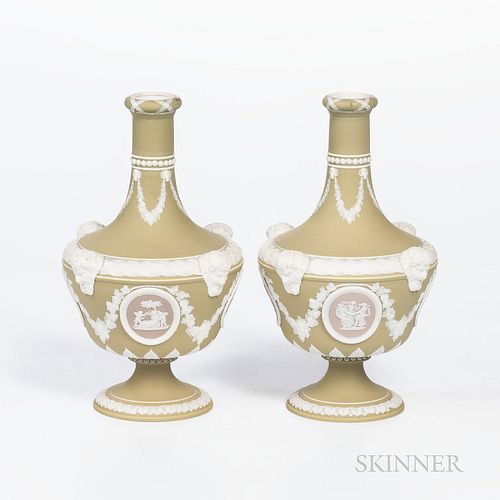 Pair of Wedgwood Tricolor Jasper Barber Bottles, England, late 19th century, green ground with lilac medallions and applied relief including Bacchus h