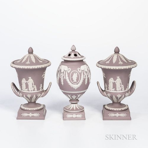 Three Wedgwood Solid Lilac Jasper Vases and Covers, England, late 20th century, each with applied white classical figures in relief, a potpourri vase 