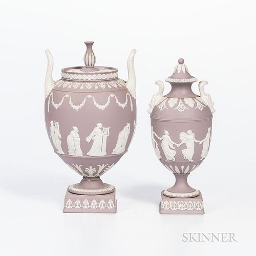 Two Wedgwood Solid Lilac Jasper Vases and Covers, England, c. 1960, each with applied white classical figures in relief, a Dancing Hours vase and cove