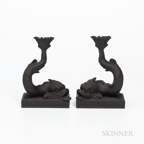 Pair of Wedgwood Black Basalt Dolphin Candlesticks, England, 1974, each mounted atop a raised rectangular base bordered with shells, impressed marks, 