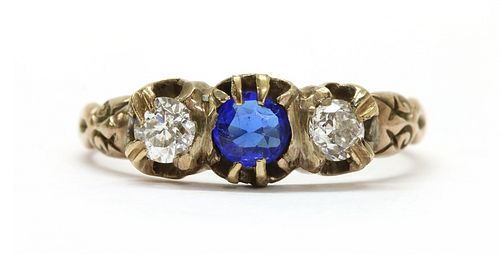 A gold garnet-and-glass doublet and diamond three stone ring,