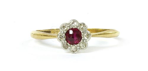 A gold ruby and diamond cluster ring,