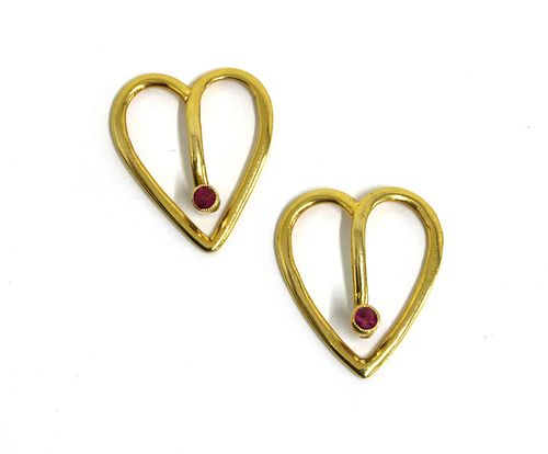 A pair of gold ruby set bow tie clips,