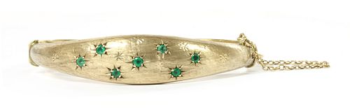 A 9ct gold emerald hinged bangle, by Smith & Pepper,