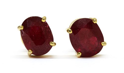 A pair of gold fracture filled ruby stud earrings,