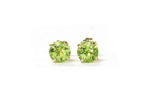 A pair of gold single stone peridot stud earrings,