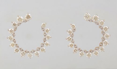 Pair of 18K Yellow Gold "Horseshoe" Earrings, each with 15 round diamonds joined by tiny round diamond mounted solid links, total diamond wt.- 4.05 ct