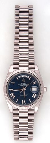 Man's 18K White Gold Rolex Oyster Perpetual Day-Date 40 Wristwatch, Model # 228239, Serial # Z6191620, with a blue face, and 18K white gold chapter ma