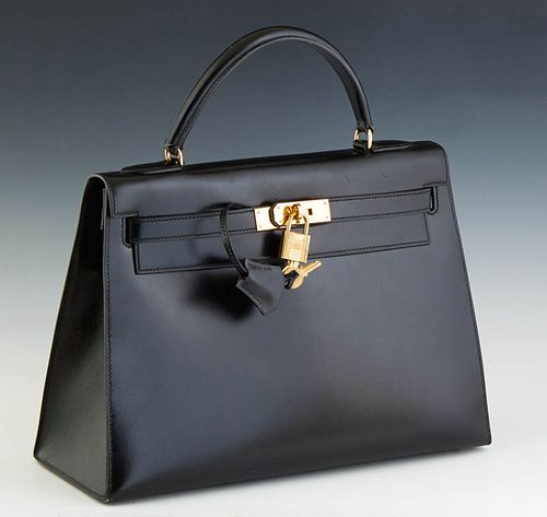 Hermes Kelly Sellier Handbag, c. 1987, in natural black box calf leather with gold hardware, opening to a matching leather lined interior, stamped Q i