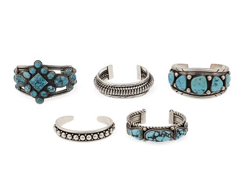 A group of Southwest cuff bracelets