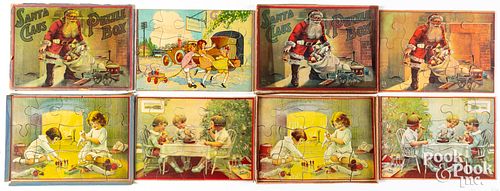 Two Milton Bradley Santa Claus puzzle boxes