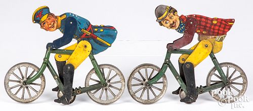 Two tin lithograph Gilbert cyclist string toys