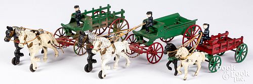 Three Kenton cast iron horse drawn wagons