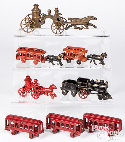 Group of cast iron trains, trolleys, and pumpers
