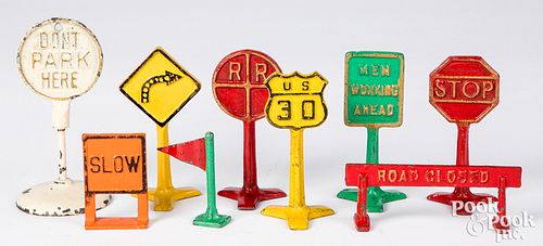 Nine Arcade cast iron traffic signs