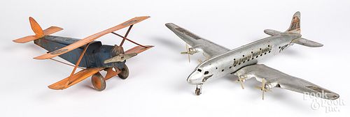 Two pressed steel airplanes