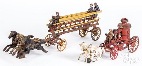 Two cast iron horse drawn fire wagons