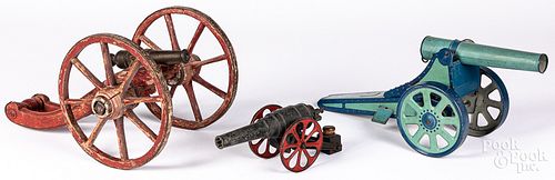 Three toy cannons