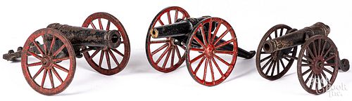 Three cast iron toy cannons