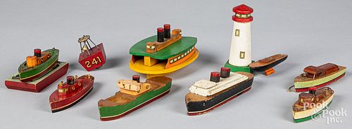Group of wood Tillicum boats and a lighthouse