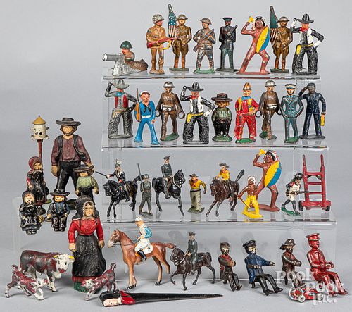 Group of iron toy soldiers and figures.