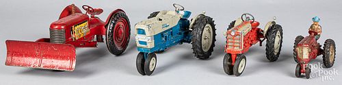 Four toy farm tractors