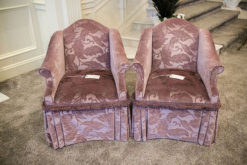 Pair (2) of Camel back arm chairs with pleated skirts and rolled arms on casters w/brush fringed trim