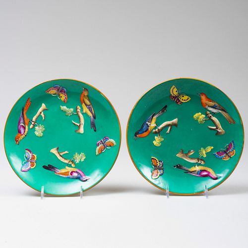 Pair of English Green Ground Porcelain Plates decorated with Birds and Butterflies