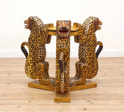 A carved wooden, papier mâché and painted occasional table,