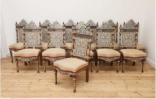 A set of twelve walnut, bone and mother-of-pearl inlaid dining chairs,