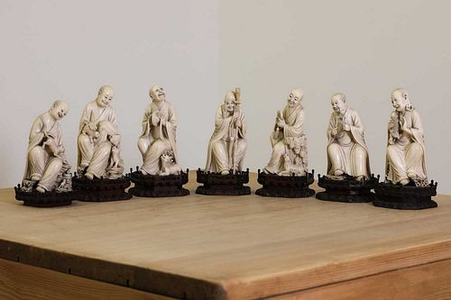 A set of eighteen Chinese carved ivory figures,