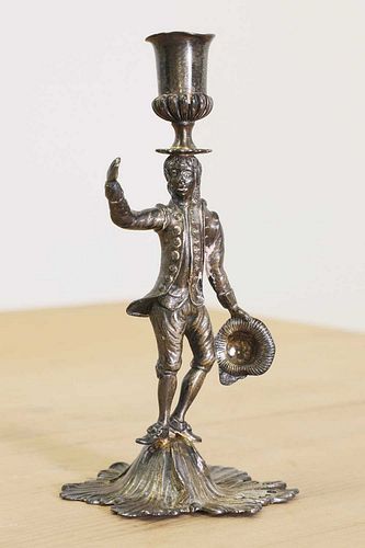 A George III cast silver gilt figural taper stick,