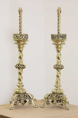 A pair of impressive brass altar stick lamps,