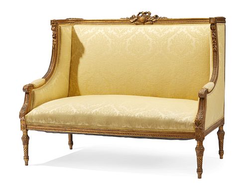 A French Louis XVI-style settee with yellow damask upholstery