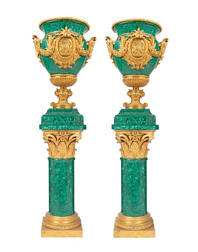 A pair of Continental monumental malachite urns on stands