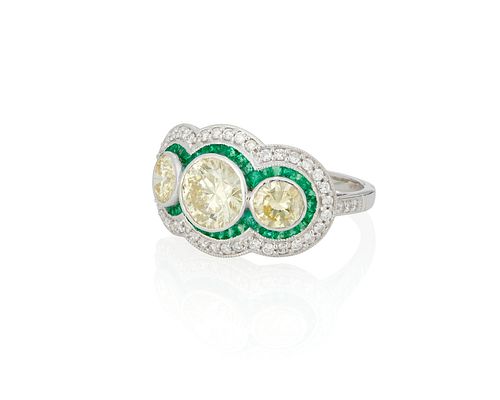 A colored diamond, near colorless diamond and emerald ring