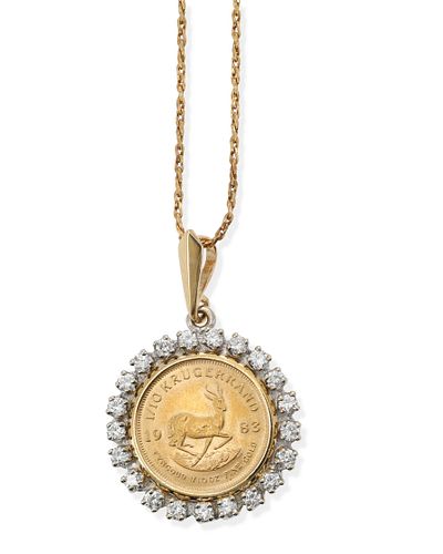 A gold coin and diamond pendant necklace