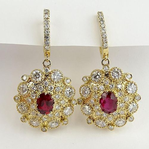 Lady's Fine Quality 2.50 Carat Oval Cut Ruby, 7.00 Carat Round Cut Diamond and 14 Karat Yellow Gold Earrings.