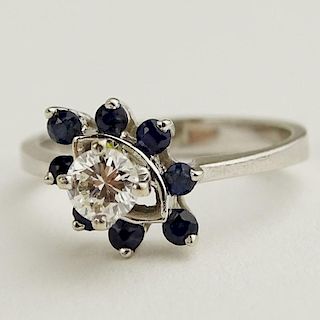 Vintage Lady's Round Brilliant Cut Approx. .25 Carat Diamond Center Stone and Sapphire 14 Karat White Gold Engagement Ring.