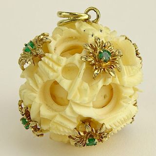 Ivory Carved Puzzle Ball Pendant with 14 Karat Yellow Gold Emerald Mounted Flowers.